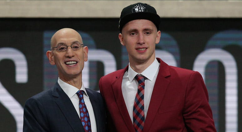 Dzanan Musa poses with NBA commissioner Adam Silver after being drafted by the Brooklyn Nets on June 21, 2018.