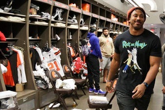 FILE - In this Dec. 30, 2019, file photo, Cleveland Browns defensive end Myles Garrett walks through the locker room at the NFL football team's training camp facility in Berea, Ohio. (AP Photo/Tony Dejak, File)