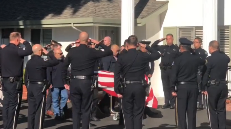 Police cars and motorcycles escorted Kevin Nishita's body 41 miles from Alameda County to a Mountain View funeral home, flashing their red and blue lights as two helicopters flew above them.