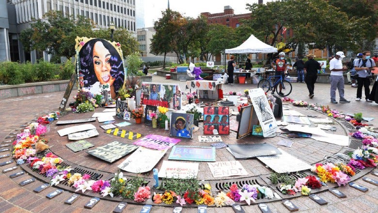 People visit a makeshift memorial for Breonna Taylor on September 24, 2020 in Louisville, Kentucky.