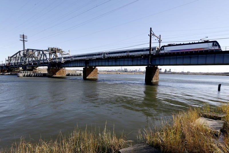 In this Nov. 14, 2014 file photo, a New Jersey Transit train crosses a portal bridge in Kearny, N.J. New Jersey has awarded a contract to build a new rail bridge to New York, a major milestone after years of delay, New Jersey Transit announced Tuesday, Oct. 12, 2021.
