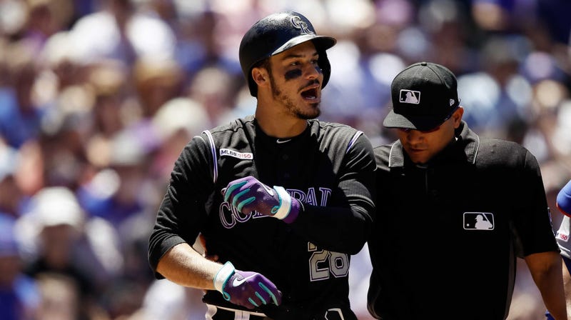 Rockies third baseman Nolan Arenado (28) reacts after being hit by a pitch by the Cubs.
