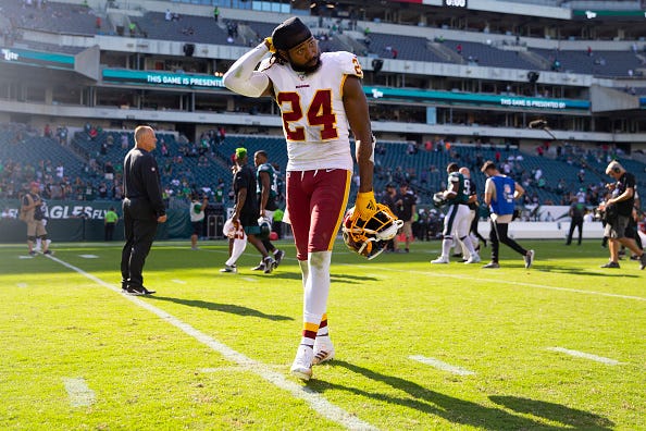 Josh Norman walks off the field in a game against the Eagles.