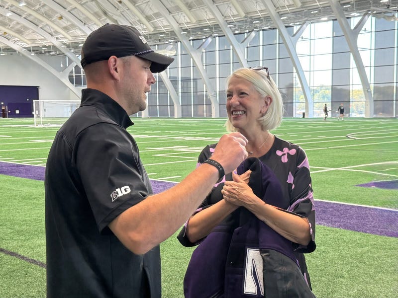 Coach Braun talks with Doug Houck's widow