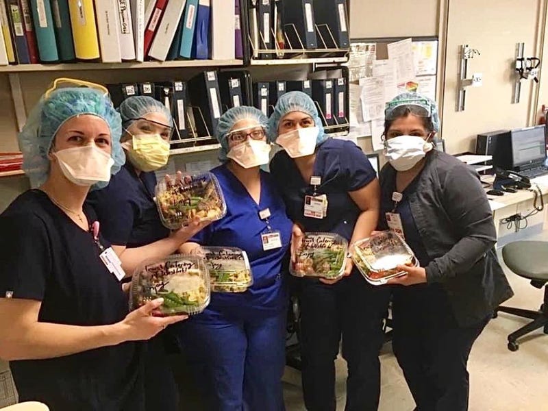 nurses holding salads