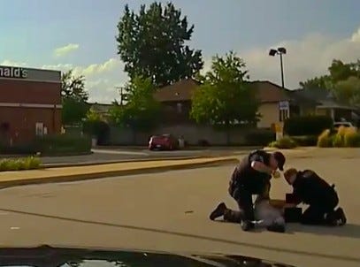 officers striking teen on ground