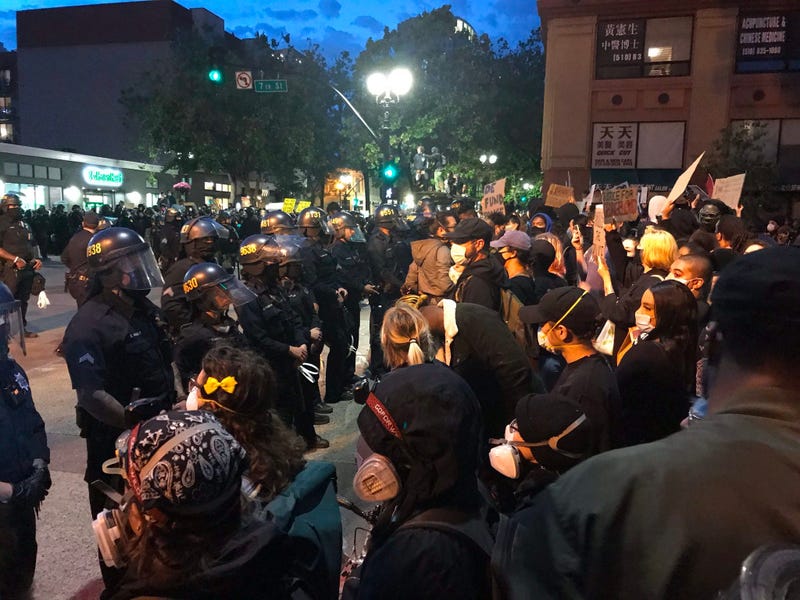 Protesters clash with police in Oakland.