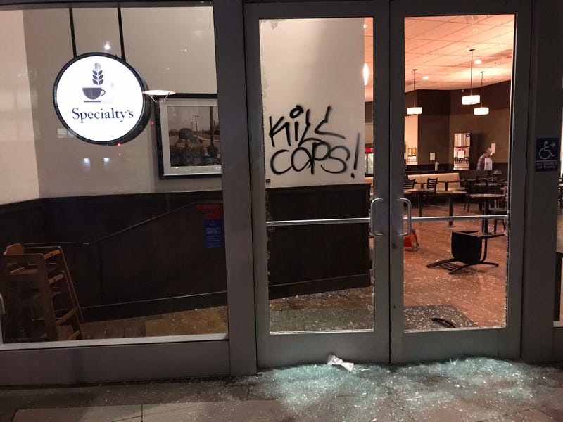 Smashed windows at a business in downtown Oakland.