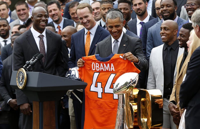 President Obama meets the Denver Broncos after the team won Super Bowl 50