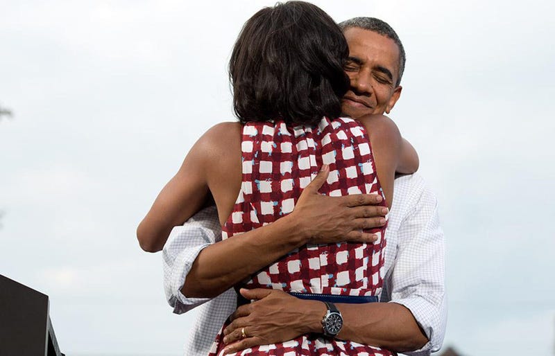 President Barack Obama and First Lady Michelle Obama hug