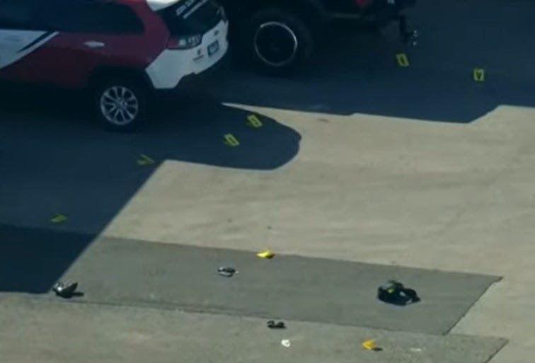 shell casings and markers at crime scene