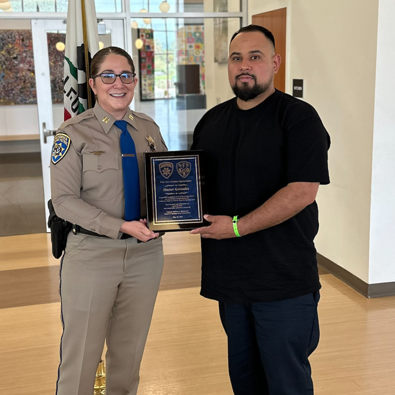 KNX Hero of the Week Hector Gonzalez (right) honored by CHP for saving Officer G. Chavez (not pictured)