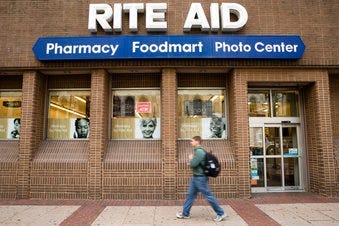FILE - In this Oct. 21, 2016, photo, a man walks past a Rite Aid in Philadelphia. Pharmacy chains, including Rite Aid, are fighting claims that they're to blame for the opioid crisis in two Ohio counties. (AP Photo/Matt Rourke, File)