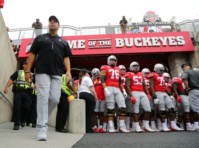 Ohio State Buckeyes head coach Ryan Day walks to the field with his team before the game against the Florida Atlantic Owls at Ohio Stadium