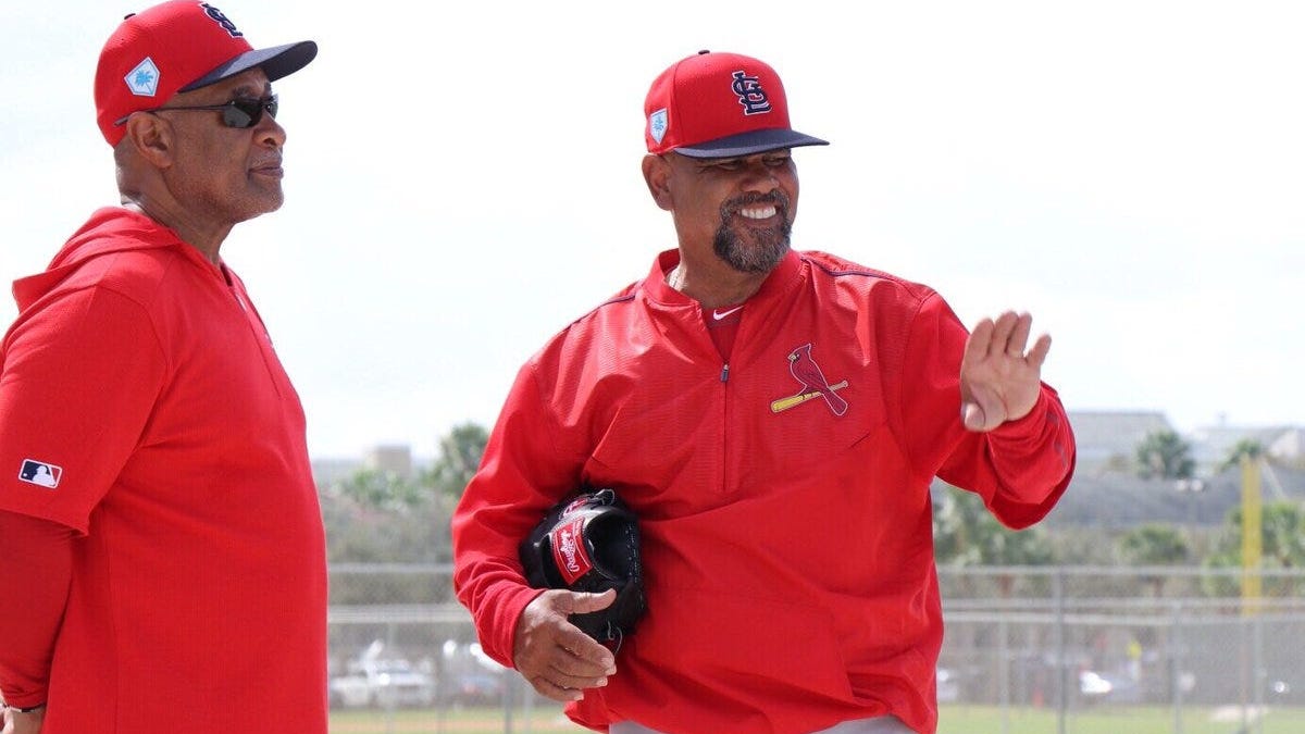 Ozzie, Oquendo still put the 'hands' in a hands-on coaching