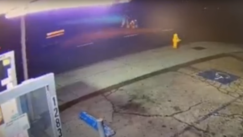 security footage of car speeding down road at night