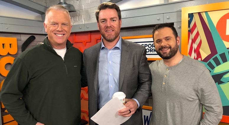 Carson Palmer poses with Boomer Esiason and Gregg Giannotti on Jan. 4, 2019.