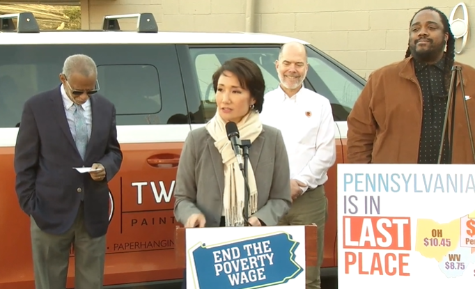 Pennsylvania state Senator-elect Patty Kim (center) addresses reporters at Two Dudes Painting Company in Lancaster, Pa. on Tuesday, Dec. 31, 2024, flanked by (l to r.) state Sen. Art Haywood, Two Dudes owner Pete Barber and state Rep. Ismail Smith-Wade-El.