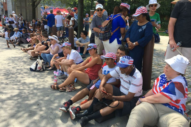 People wait along Independence Mall in Philadelphia for the 2019 Independence Day Parade to start. 