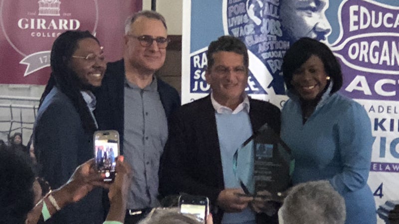 Mayor Cherelle Parker (right) presents the Harris Wofford Citizenship Award to lobbyist Ed Hazzouri (second from right), along with Councilman Jeff Young (left) and Global Citizen founder Todd Bernstein.