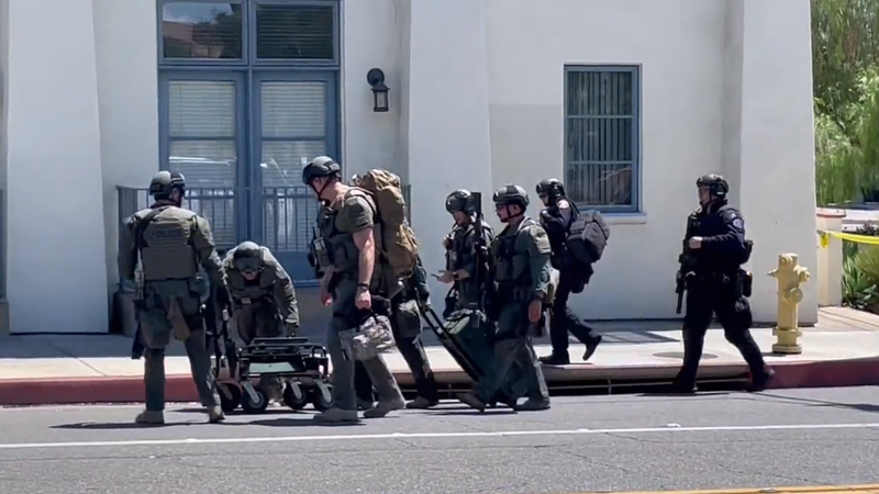 police teams outside an apartment building