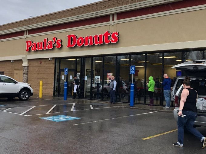 Customers wait in line outside of Paula's in West Seneca as the restaurant closes due to coronavirus. March 20, 2020 (WBEN Photo/Mike Baggerman)