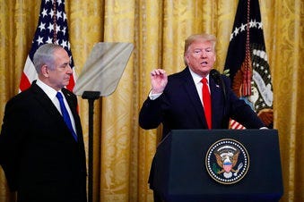 President Donald Trump, joined by Israeli Prime Minister Benjamin Netanyahu, speaks during an event in the East Room of the White House in Washington, Tuesday, Jan. 28, 2020. (AP Photo/Alex Brandon)