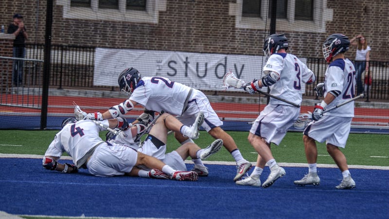 The University of Pennsylvania men's lacrosse team celebrates beating defending national champion Yale.