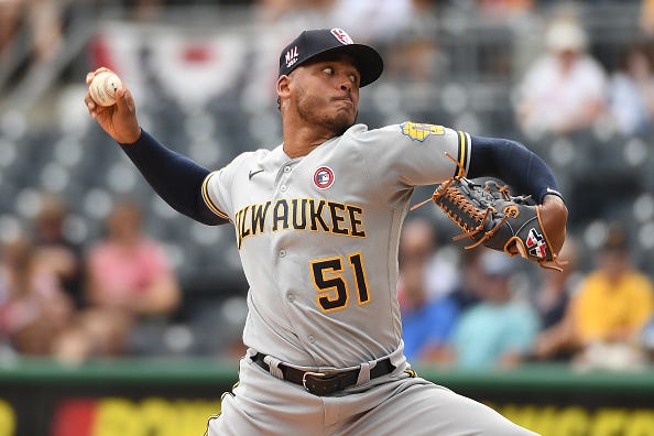 Freddy Peralta pitches for the Brewers