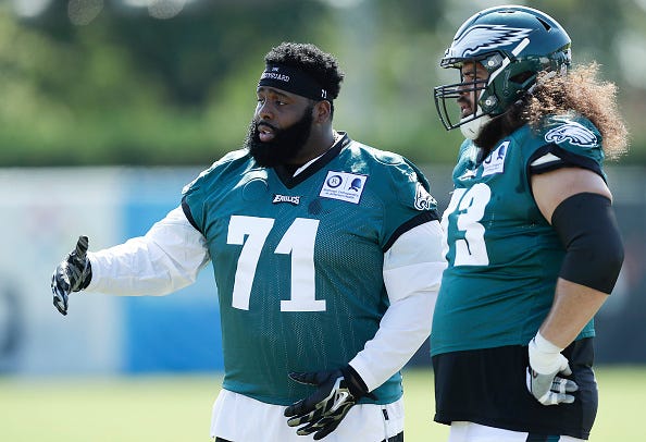 Jason Peters chats with a teammate at an Eagles practice. 