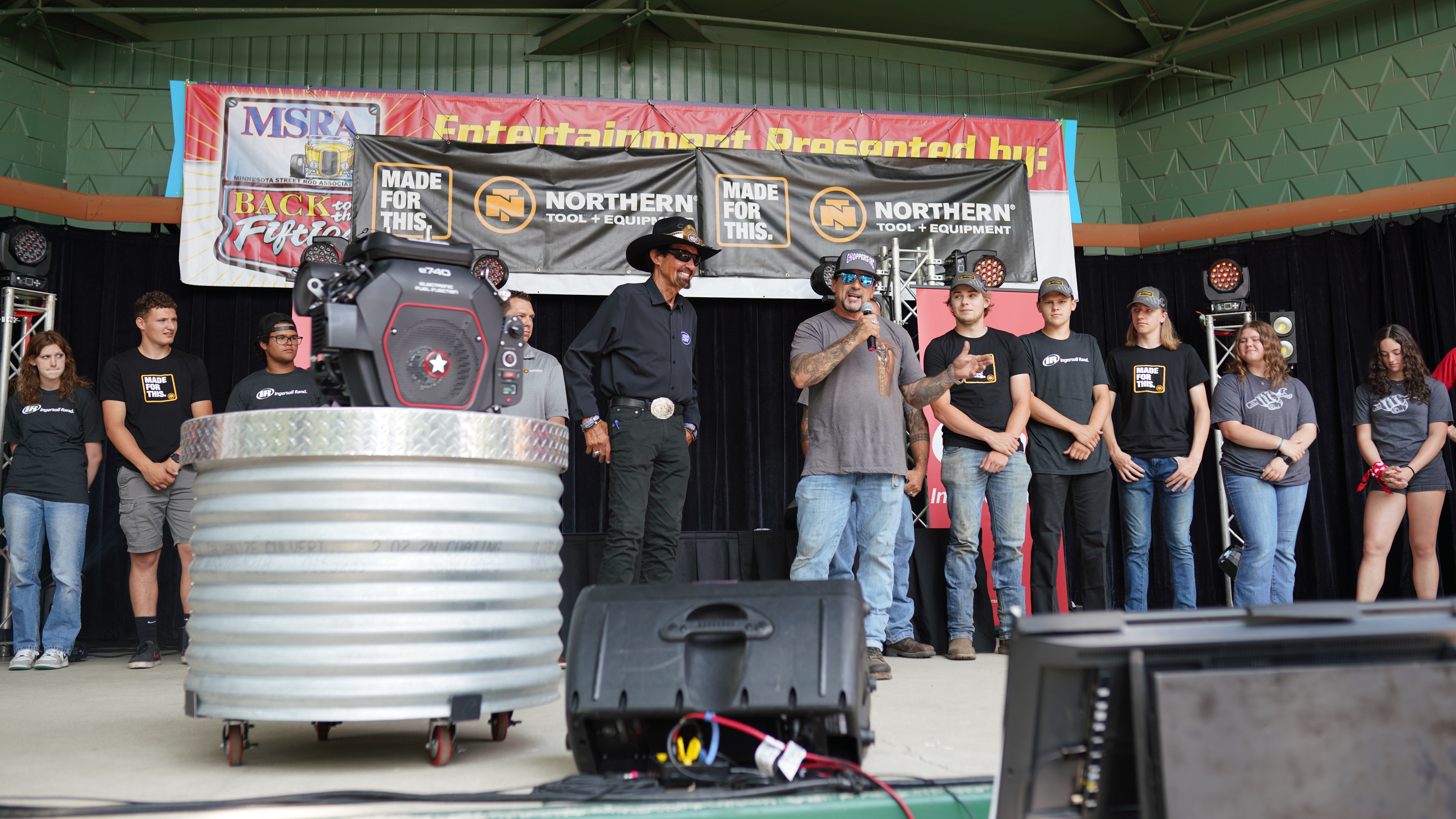NASCAR legend Richard Petty and celebrity bike builder Billy Lane mentoring Minneapolis North and Lakeville North students in go-kart build-off