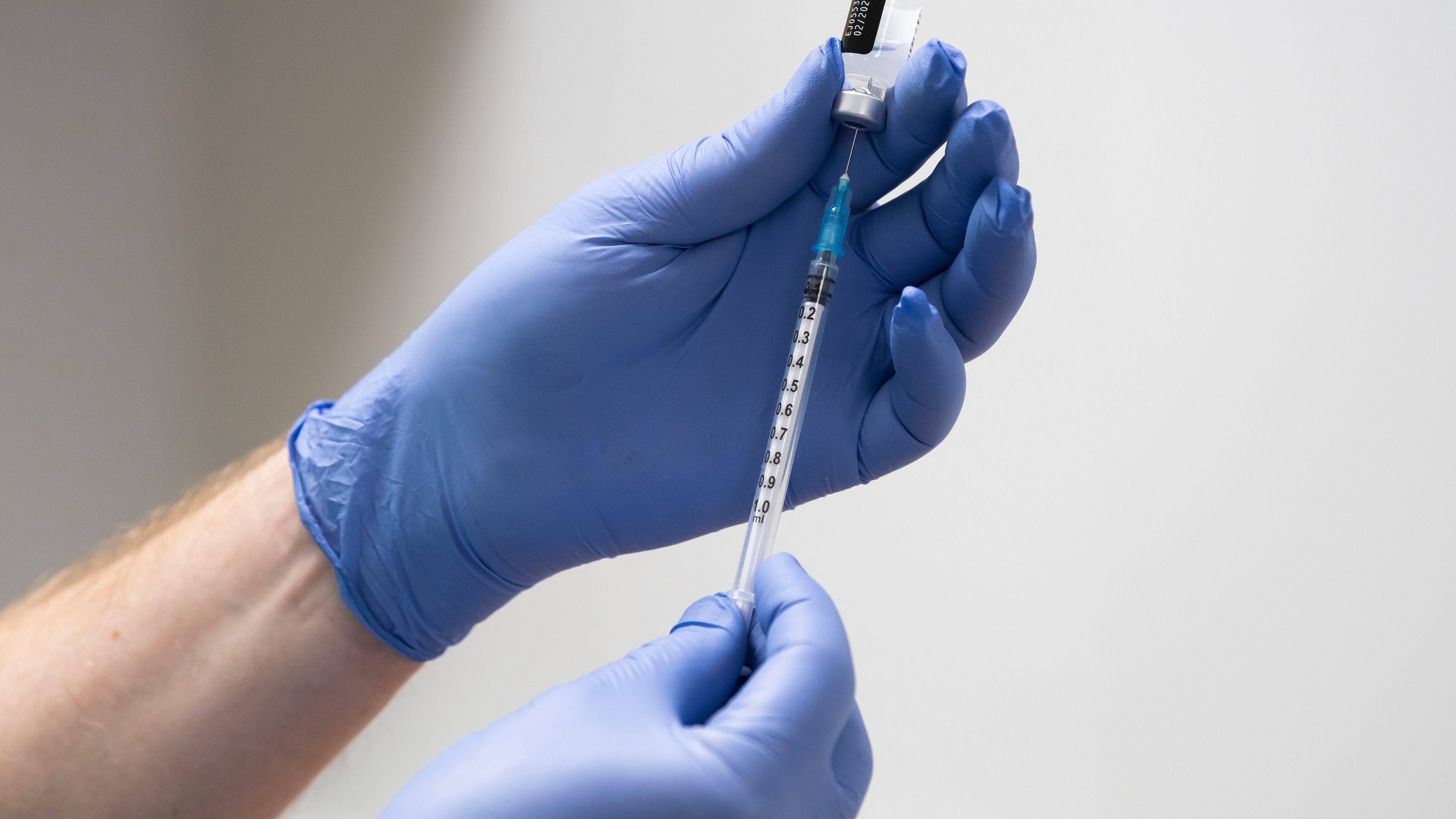 Debate grows over delaying second vaccine doses