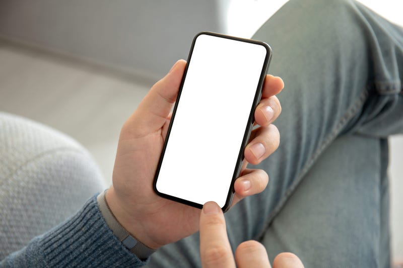 man holding phone with an isolated screen