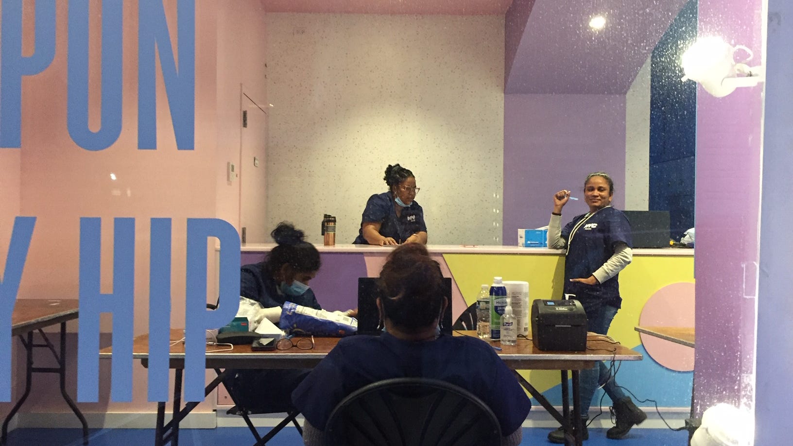 PHOTOS: Huh? Why are workers at NYC-run COVID test site not wearing masks?