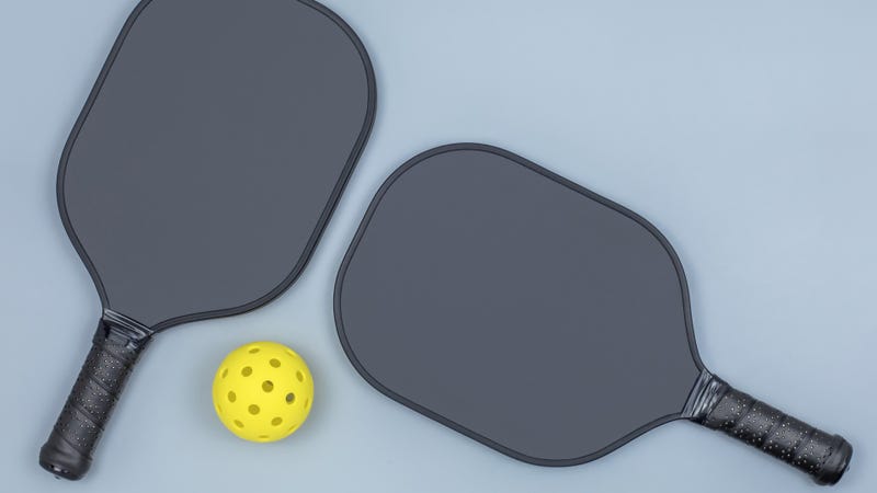 Pickleball paddles and ball - stock photo
