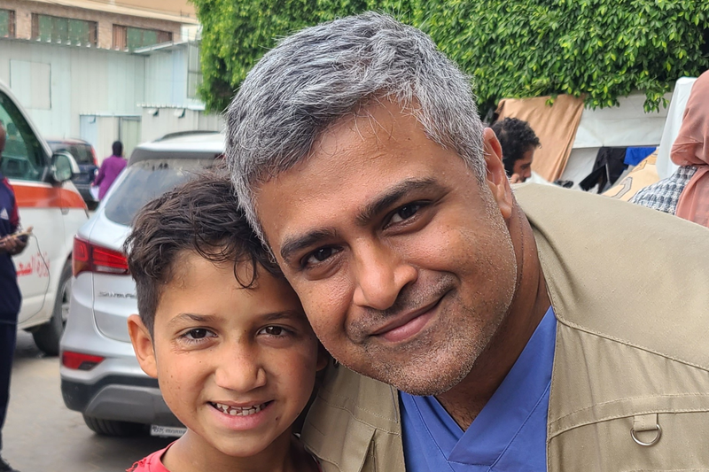 Dr. Syed Sayeed, a plastic surgeon from Long Island, poses for a photo with Zakaria, an orphaned child who resides at Al Aqsa Hospital in Gaza. 
