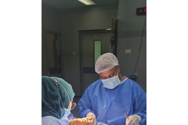 Dr. Syed Sayeed, a plastic surgeon from Long Island, operating on a patient during a volunteer trip to Gaza in April 2024.