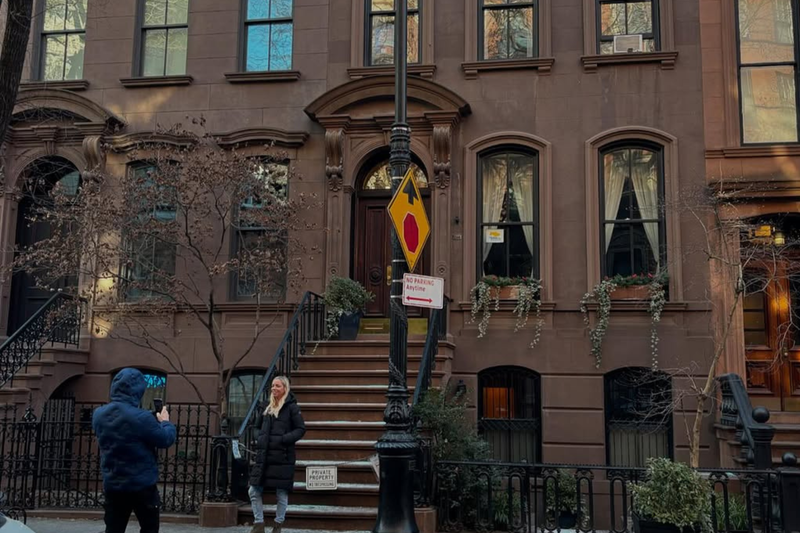 Tourists taking pictures in front of Carrie Bradshaw’s West Village apartment in HBO’s Sex and the City on Jan. 14, 2025.