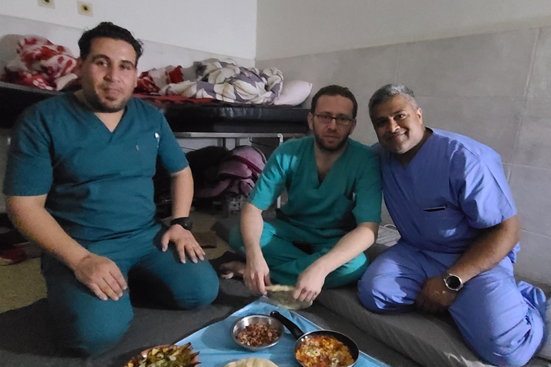 Dr. Syed Sayeed, a plastic surgeon from Long Island, poses with fellow doctors during a volunteer trip to Gaza in April 2024. The gentleman immediately next to him is a surgeon, and the one to the far left is an operating room nurse