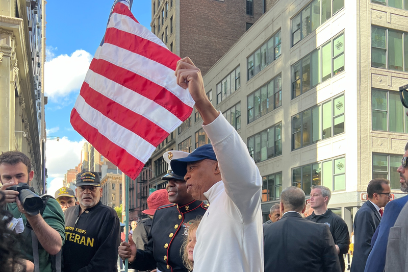 Mayor Eric Adams poses with the American flag in the annual Veterans Day Parade on Nov. 11, 2024 in New York City.