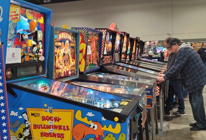 Line of pinball machines at expo in Chicago