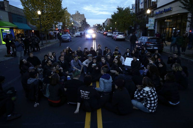 Protesters demonstrate on a main road in the Squirrel Hill neighborhood of Pittsburgh Tuesday, Oct. 30, 2018. 