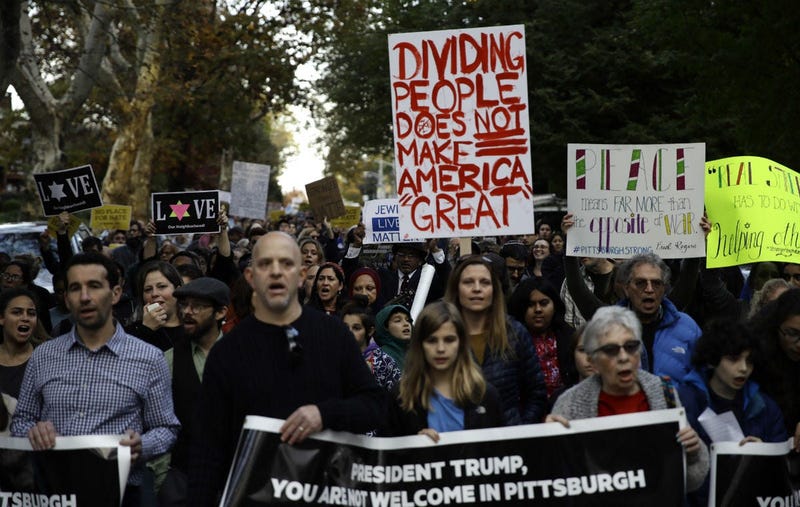 Protesters demonstrate near Pittsburgh's Tree of Life Synagogue where President Donald Trump and first lady Melania Trump were visiting a memorial in Pittsburgh, Tuesday, Oct. 30, 2018.