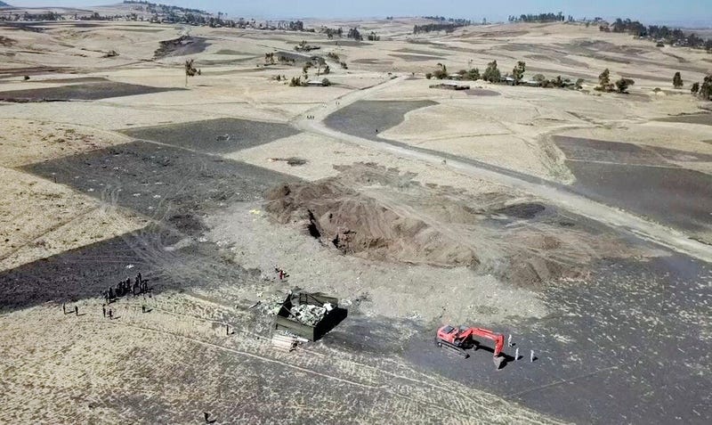 This aerial image made from video shows recovery work continuing at the scene where the Ethiopian Airlines Boeing 737 Max 8 crashed shortly after takeoff on Sunday killing all 157 on board,