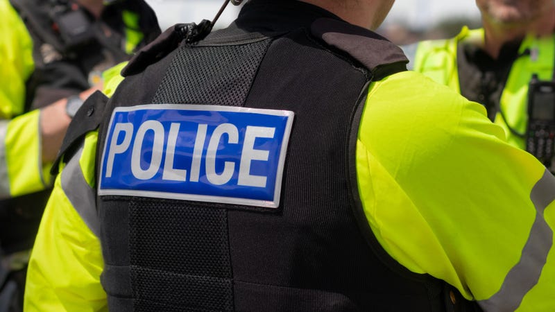 Trio of police officers on duty - stock photo