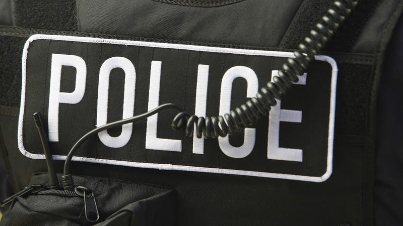 Policeman's sign and cord on protective Jacket - stock photo