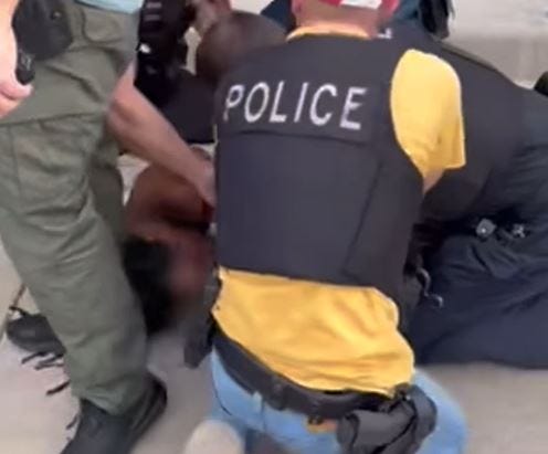 Still captured from arrest video.