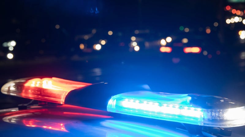 Police car with flashing lights on at night