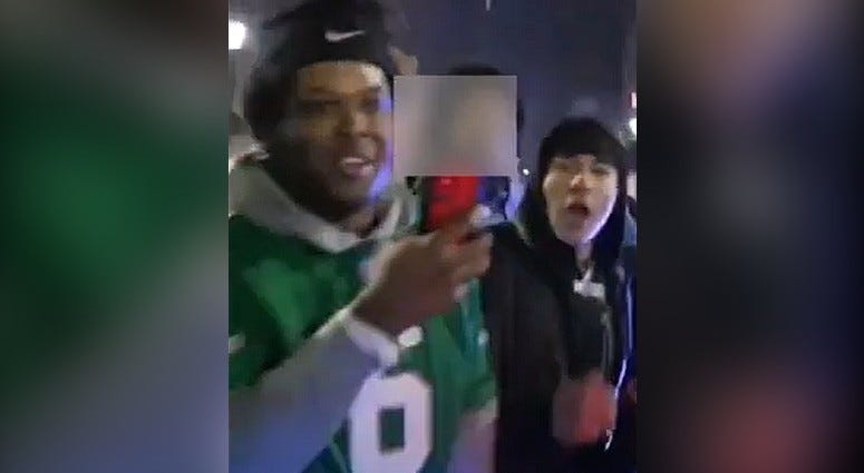 Screenshot of two men police say assaulted an officer Sunday, Feb. 9 during Super Bowl celebrations on Broad and Chestnut streets