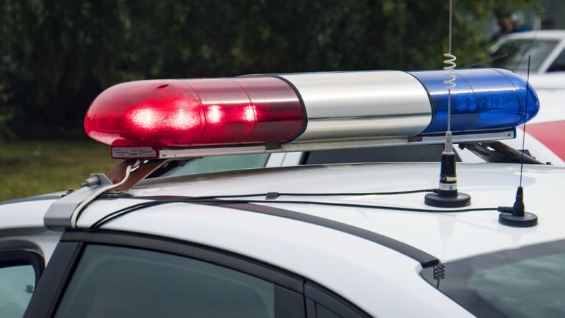 A close up of a rotating beacon on a police car